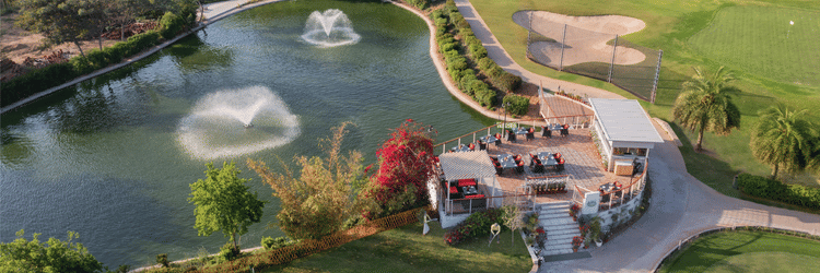 Overview of restaurant next to a lake at Karma Lakelands.
