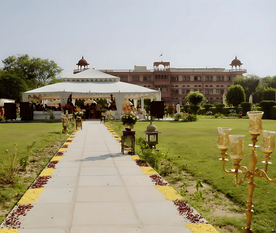 Outdoor pathway with floral decor leading to venue at Umaid Palace for Charvi & Dhruv wedding.