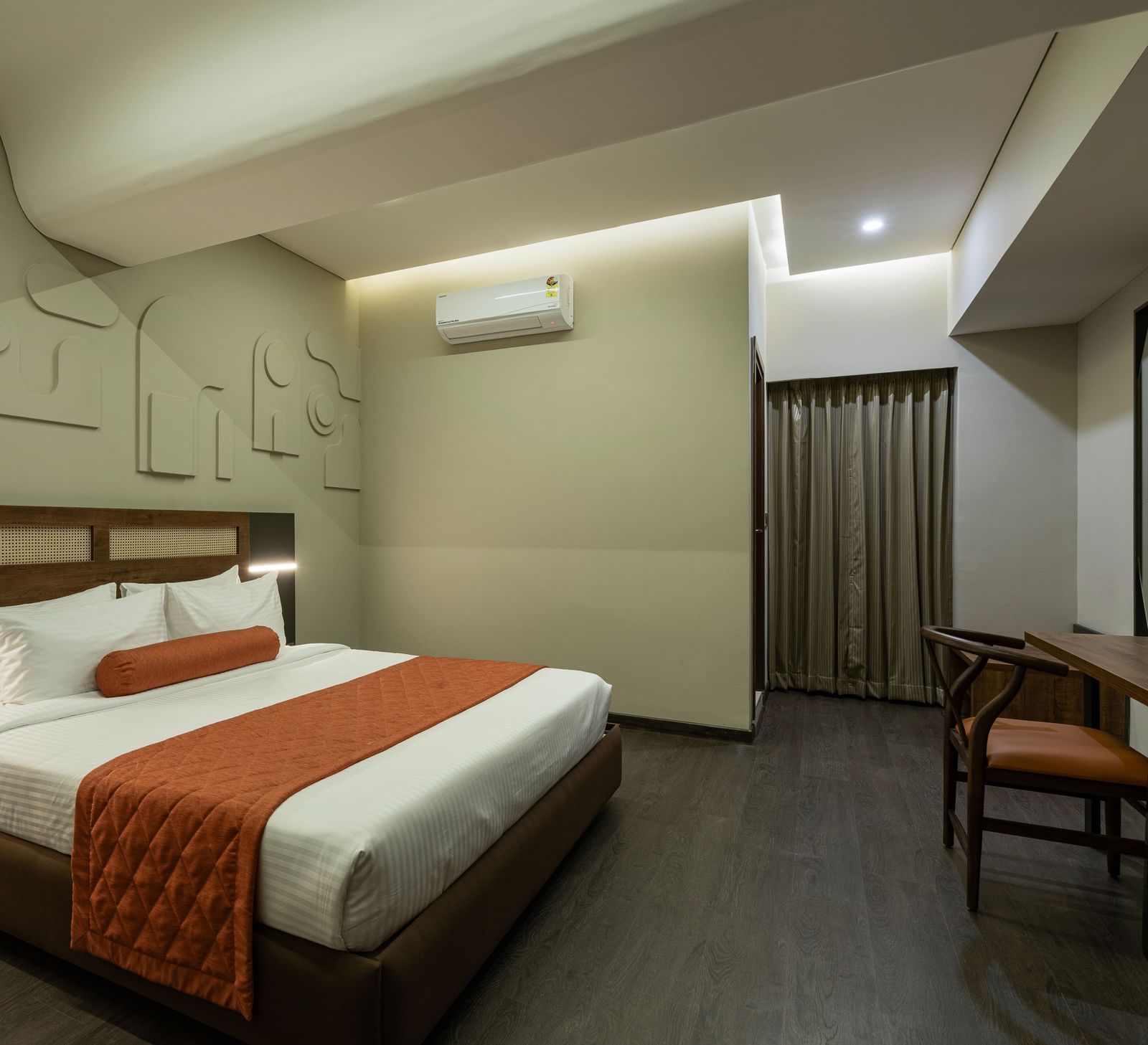 Elegant Tangerine Room offering modern amenities in a tranquil setting at Fressotel, Kanakapura Road.
