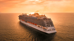 Wondering about Andaman And Nicobar Islands, How To Go there? A cruise ship! it is sailing on a waterbody towards the sunset.