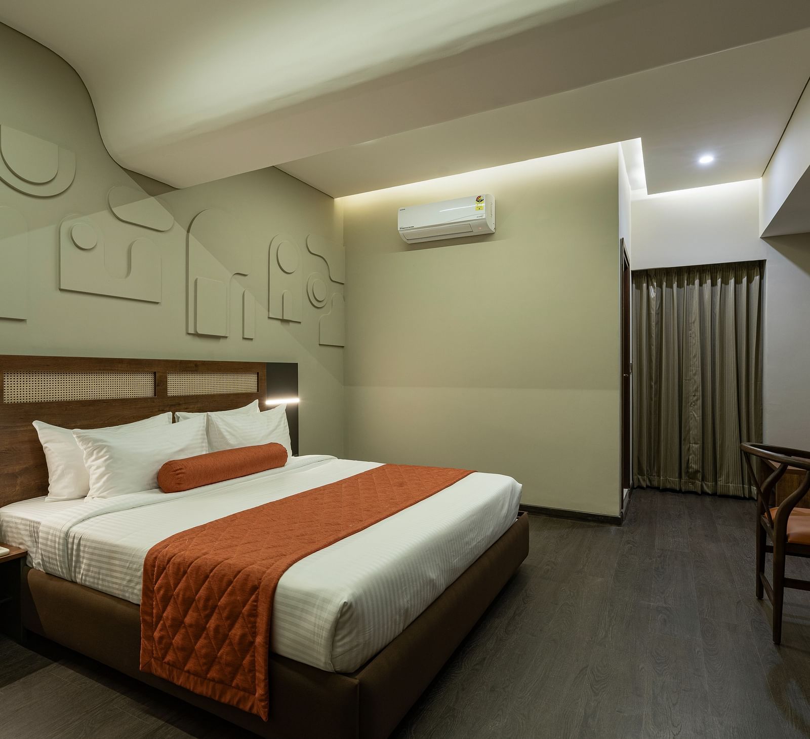 Elegant Tangerine Room offering modern amenities in a tranquil setting at Fressotel, Kanakapura Road.