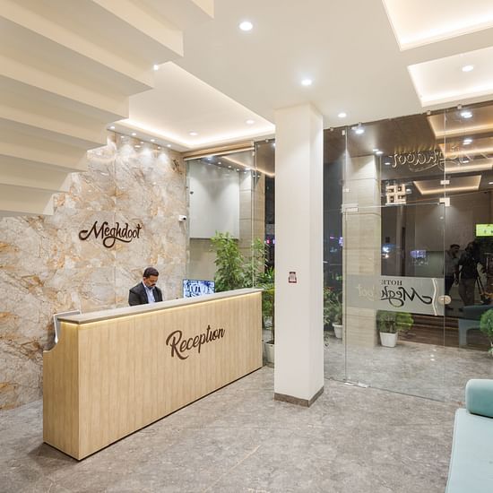 A person standing at the reception area of Hotel Meghdoot, Bhopal