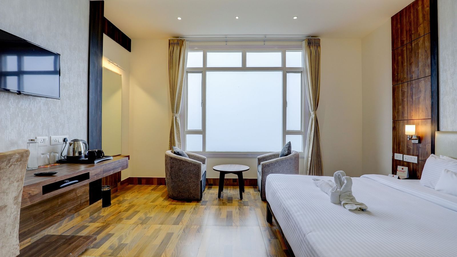 view of king size bed and TV of a Deluxe Room Banari Regency by Summit, Namchi