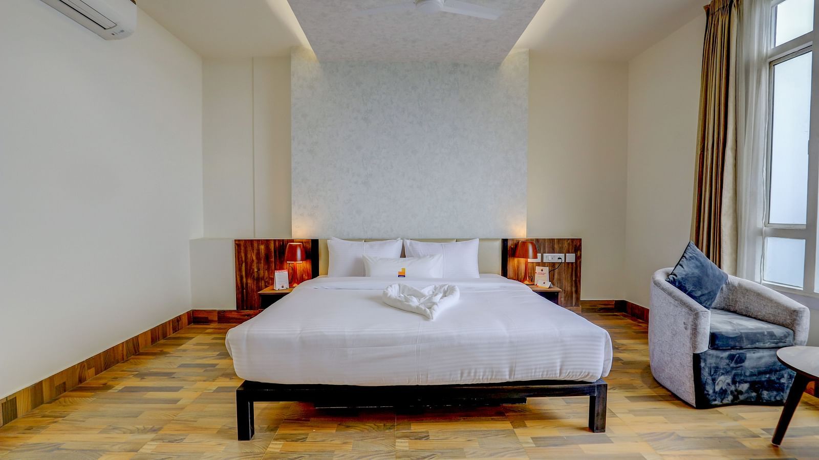 view of a king size bed of a Suite at Banari Regency by Summit, Namchi