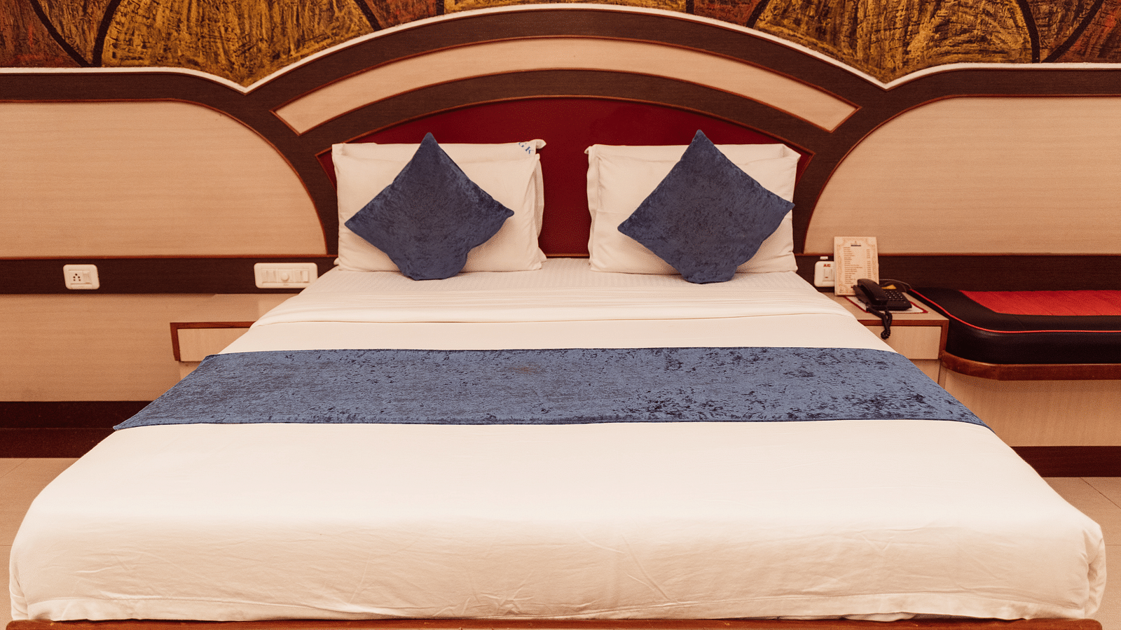 image featuring a double bed at the Executive Room at The Grand Krishna Rooms in Benagluru