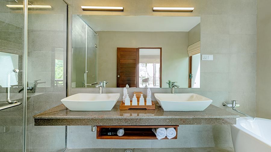A front view of two sinks and a mirror on the wall | Celestial Hills - Villas & Suites, Kandy