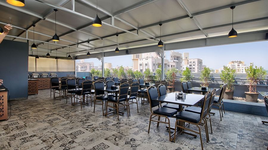Seating arrangement inside the Restaurant in the morning - Magnus Fortune House, Magarpatta