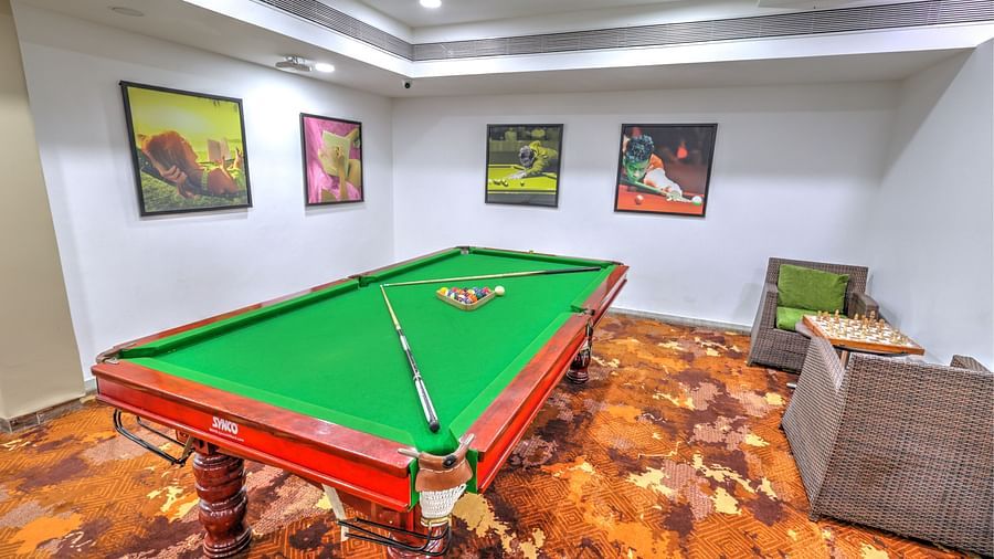 An snooker table and a chess board in the corner at Sobit Sarovar Portico, Goa