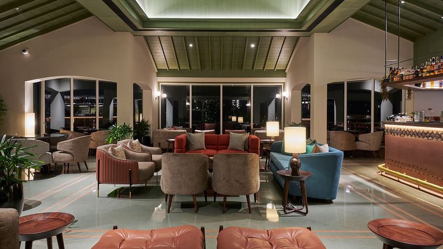 Bar seating area with stylish stools and a well-stocked bar in a modern setting at The Dukes Retreat