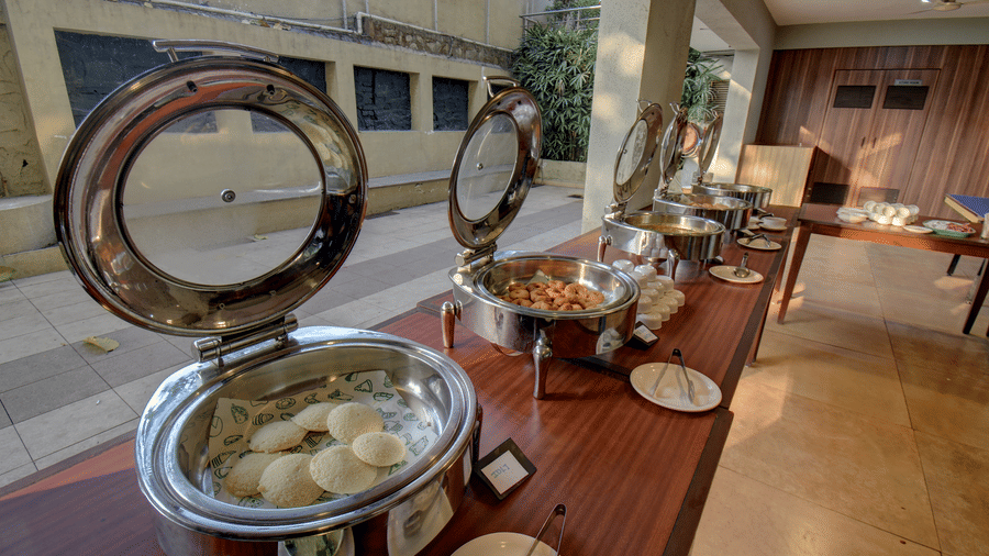 Buffet counter with hot dishes served in chafing dishes at VITS Lonavala.