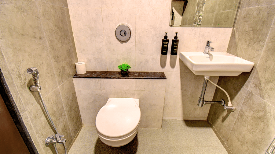 Super Deluxe Room bathroom with grey marble tiles and premium toiletries at VITS Select Kharadi Pune