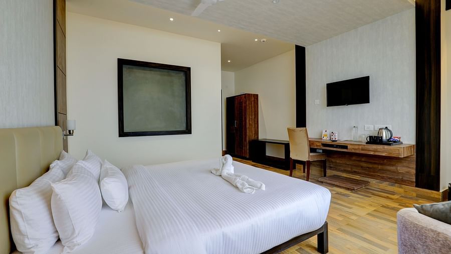 view of king size bed and TV of a Deluxe Room Banari Regency by Summit, Namchi