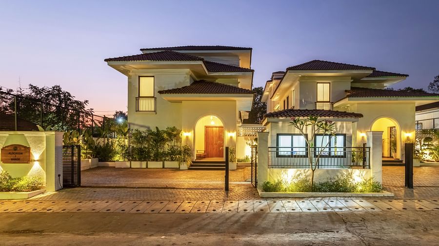 A wide-angle view of a luxury villa at twilight, highlighting its contemporary design and well-maintained facade - BluSalzz Villas - Alocassia, Anjuna