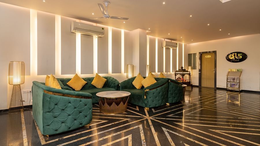 A shot taken from an angle of the waiting area near the reception with sofa sets and coffee table - DLS Ganga Bliss, Haridwar