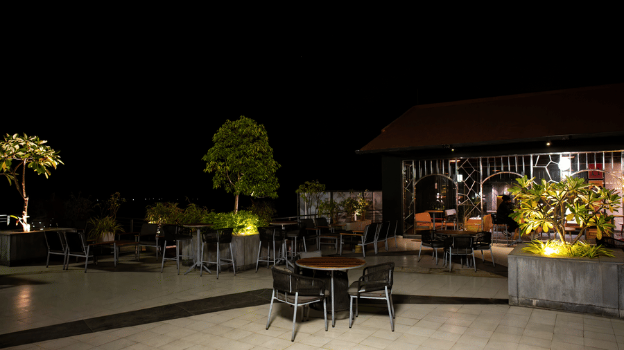 Night-time view of Hotel Sonar Bangla, Taki with illuminated exterior. 