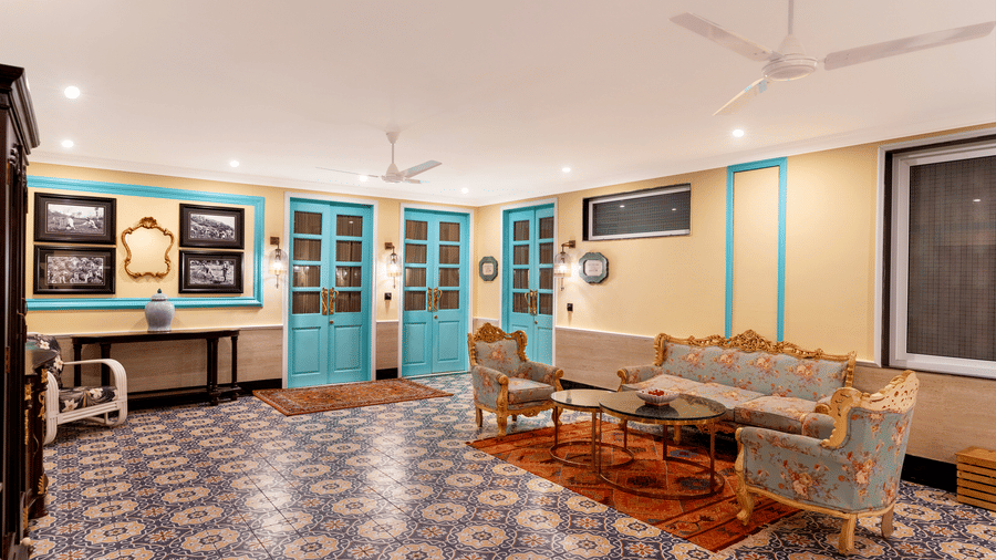 Elegantly decorated hotel lobby featuring blue doors at Mayfair Manor, Jungpana.