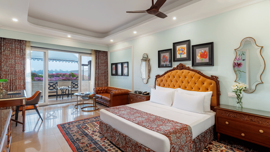 Premium Room bedroom with balcony view at Mayfair Oasis Resort, Jharsuguda