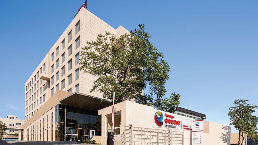 Ramada Encore by Wyndham, Bhiwadi | Hotel exterior with a geometric design and a blue sky background.