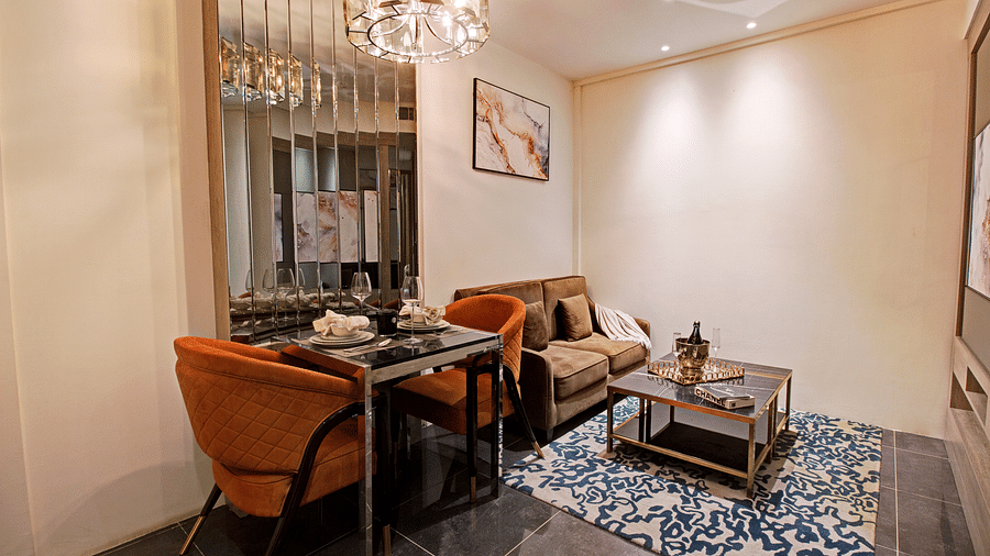 Sofas and coffee table kept inside the Living Room inside the deluxe room - Rhythm Gurugram