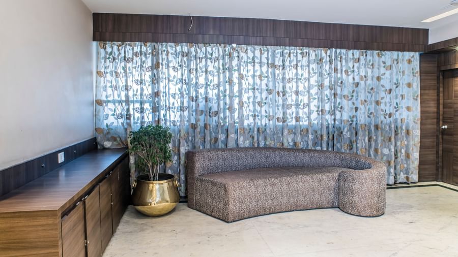 A comfortable seating area in a room at The Citi Residenci Hotel, Asansol.