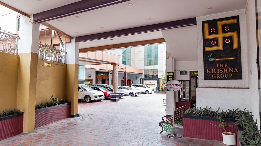 image of the entrance of The Grand Krishna Rooms with the logo of the hotel in the exterior