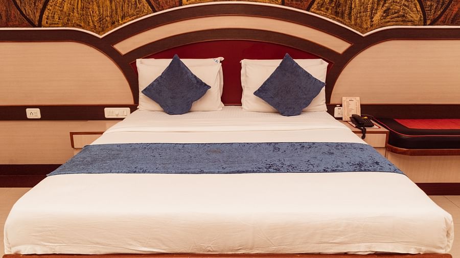 image featuring a double bed at the Executive Room at The Grand Krishna Rooms in Benagluru