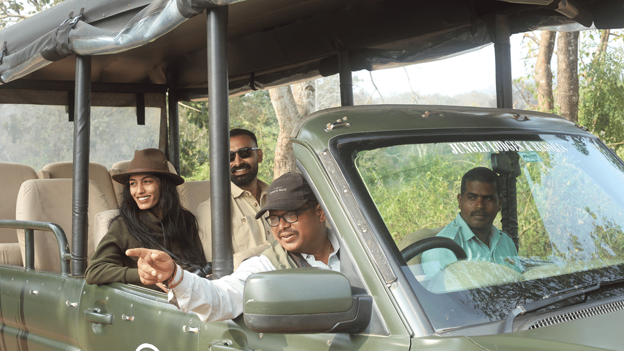 Guests on a jeep safari spotting wildlife at Evolve Back Kabini