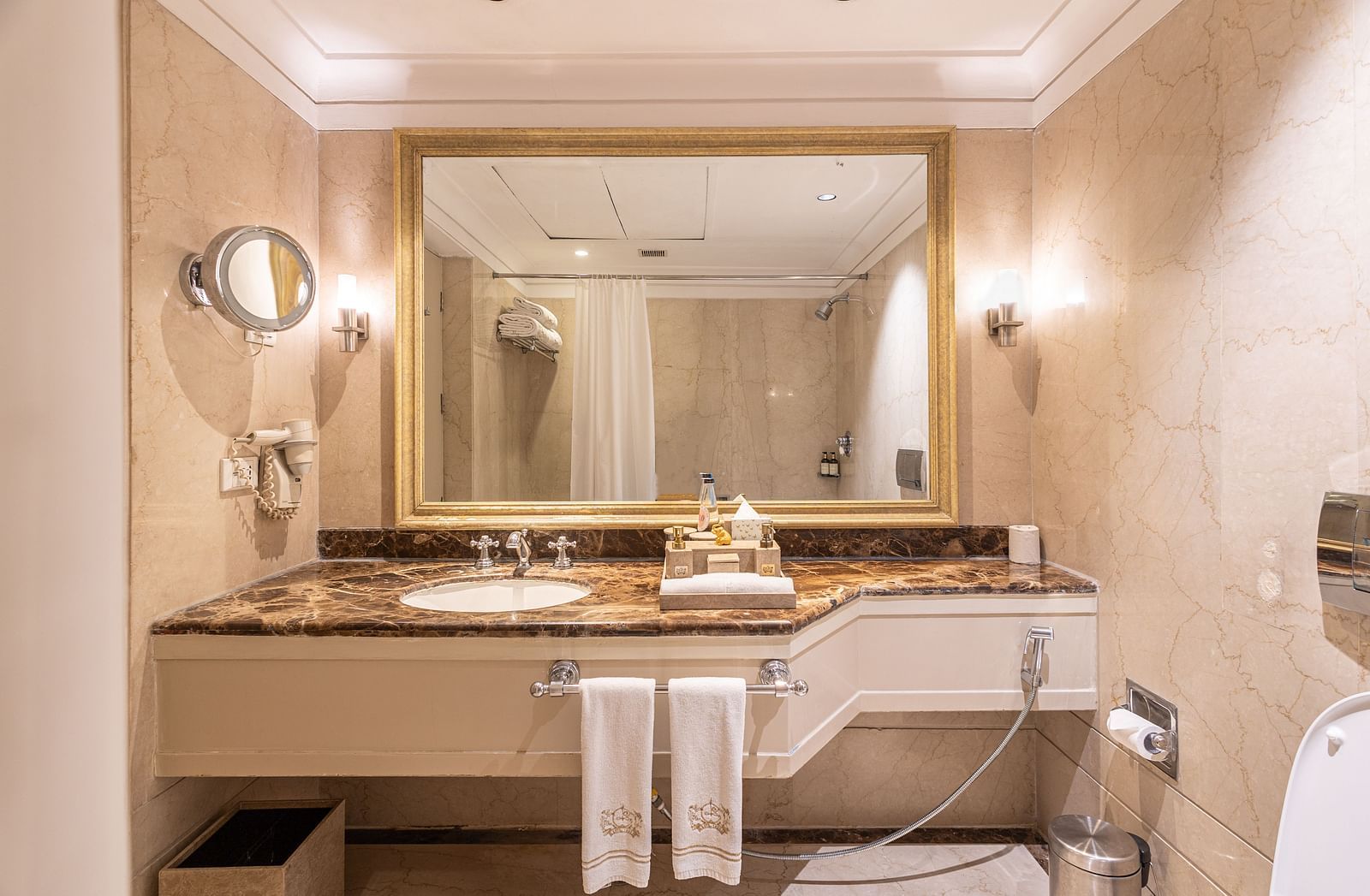 image of the bathroom with all necessary toiletries and towels for the guest at the boutique room bathroom - The Claridges New Delhi