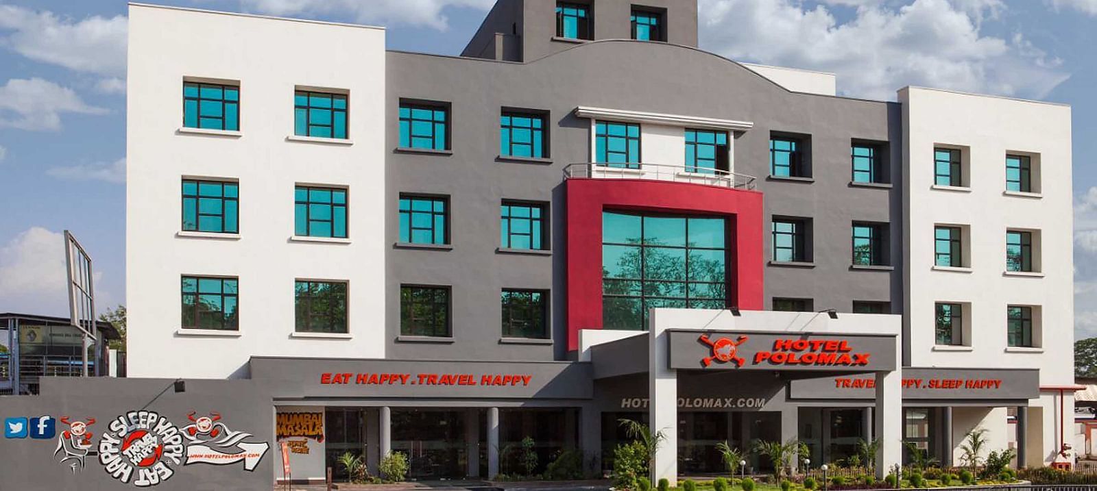 Exterior of Max Hotel Jabalpur on a sunny day with scattered clouds.