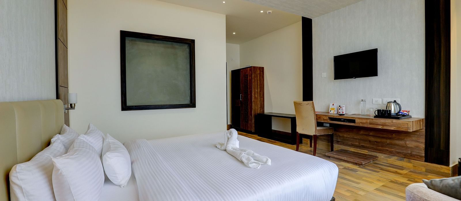 view of king size bed and TV of a Deluxe Room Banari Regency by Summit, Namchi