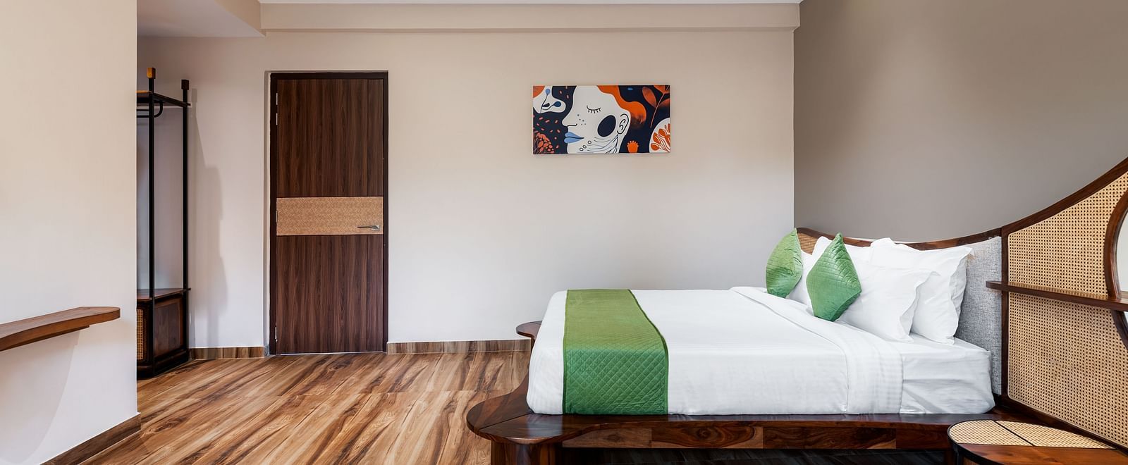 Luxury Villa with Plunge Pool with a minimalist design, featuring a green-accented king size and wooden flooring at The Qualia Resort Club & Brewery, Udaipur.
