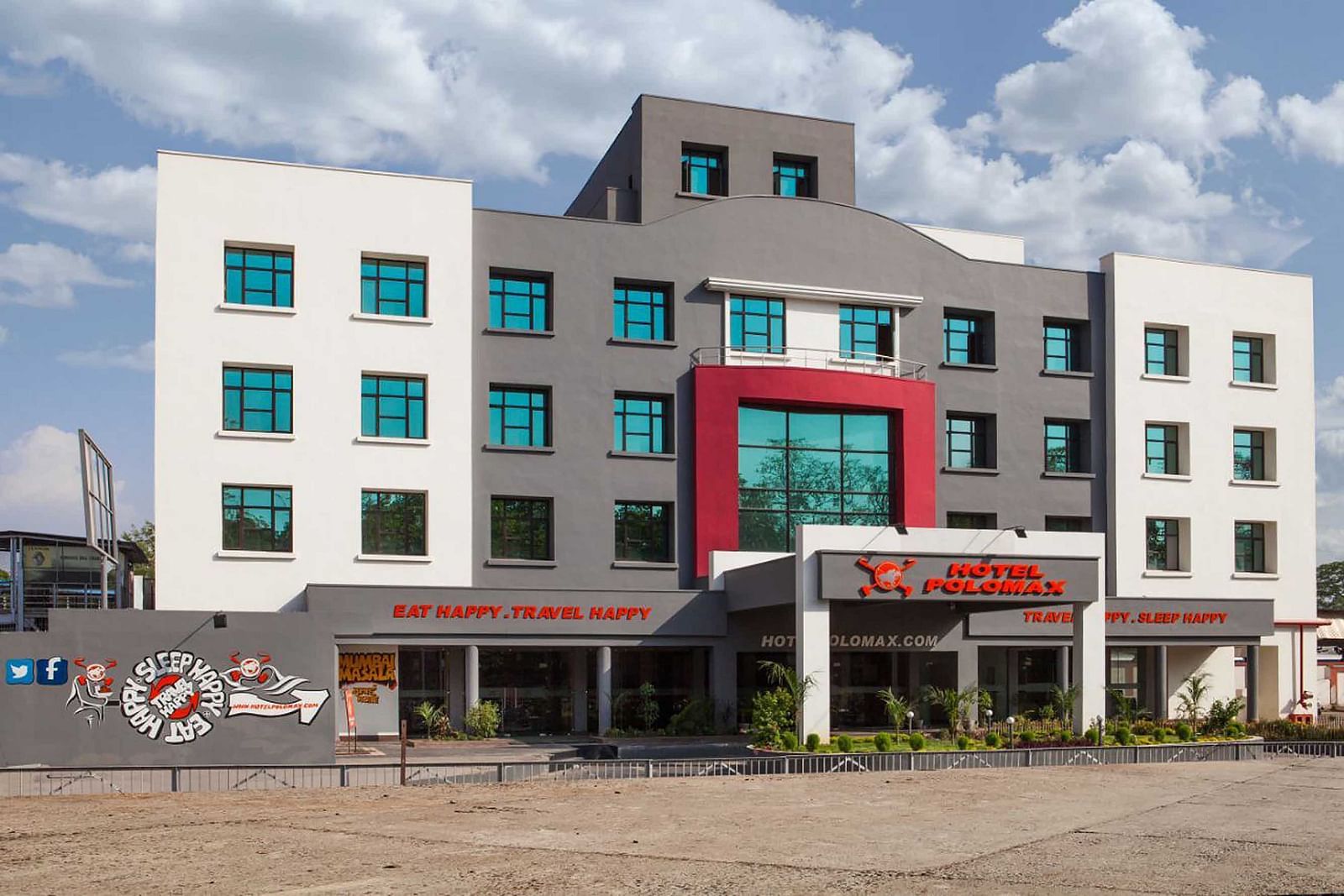 Exterior of Max Hotel Jabalpur on a sunny day with scattered clouds.