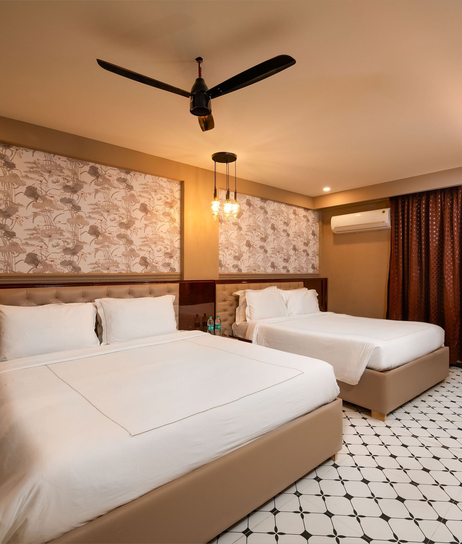 An image of a chic room with large windows, allowing natural light to fill the space at Crescent Resort, Goa.