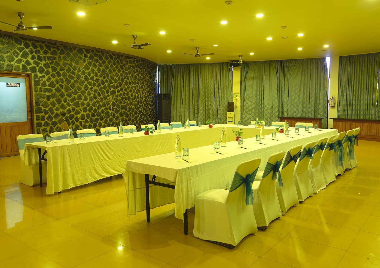 Another angle of the meeting room showcasing the seating arrangement and lighting - Great Trails Yercaud by GRT Hotels