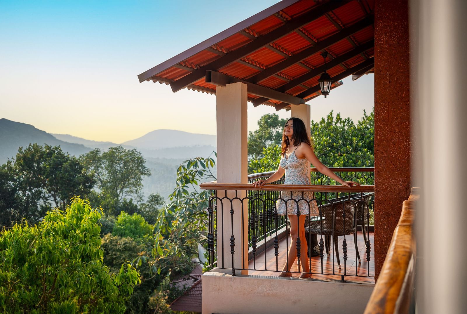  A woman enjoying a serene sunset on a private balcony
