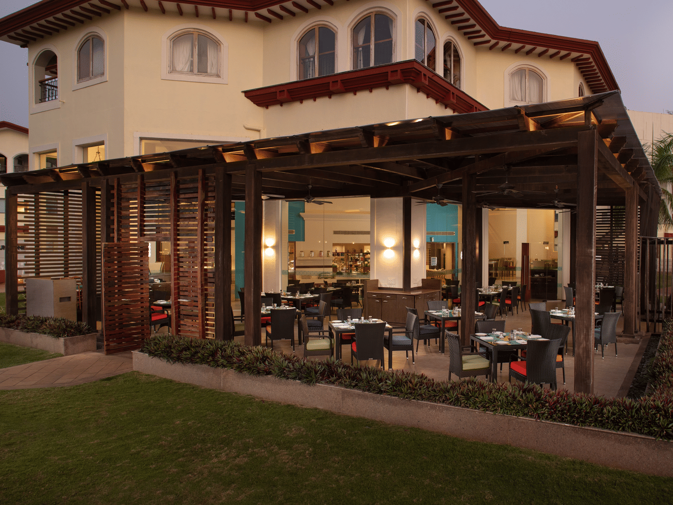 Elegant outdoor dining at Palms Restaurant, Kenilworth Resort & Spa, Goa - a premier 5-star resort in South Goa.