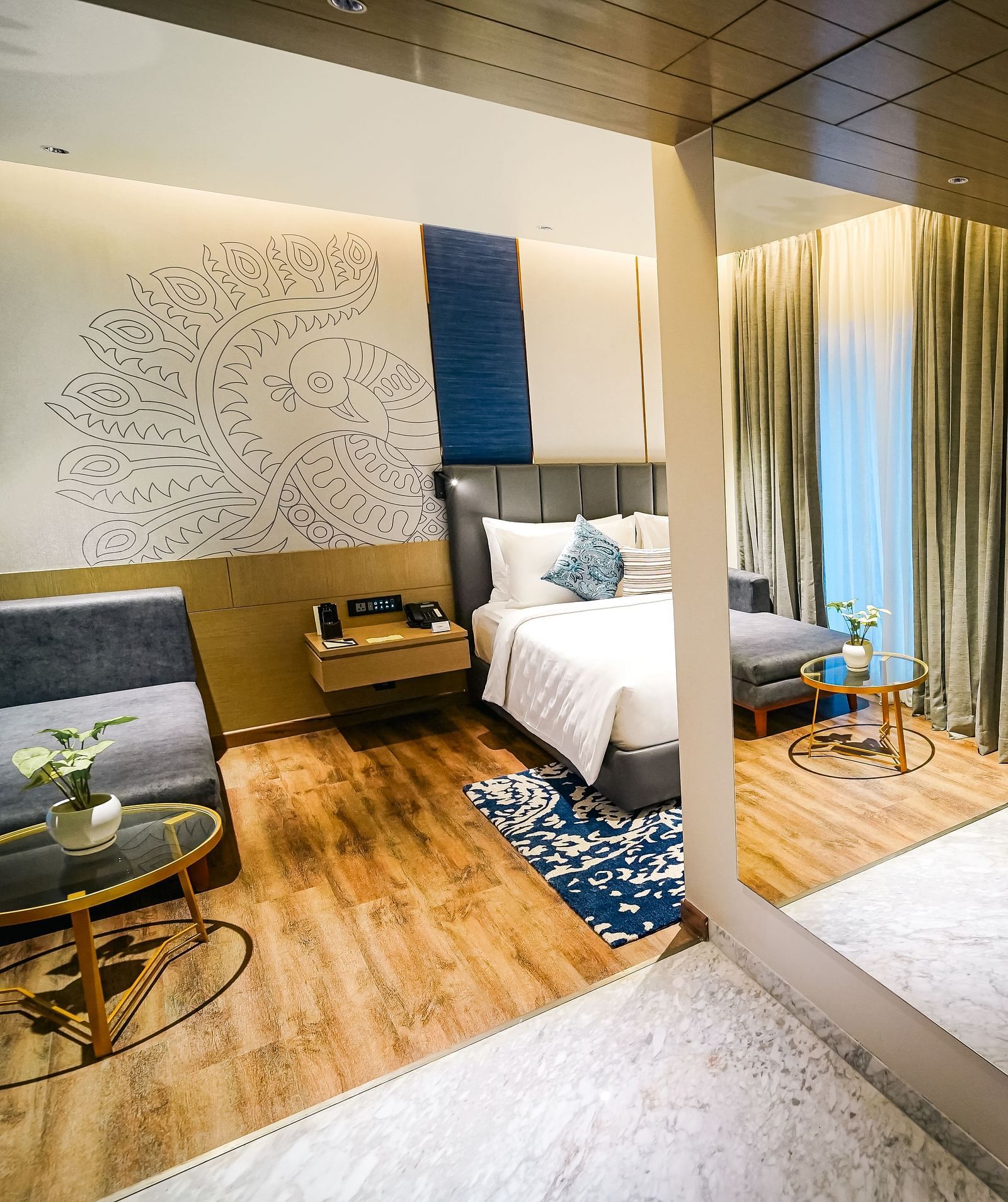 A panorama shot of the Executive Suite with a bedroom on the left and washroom on the right