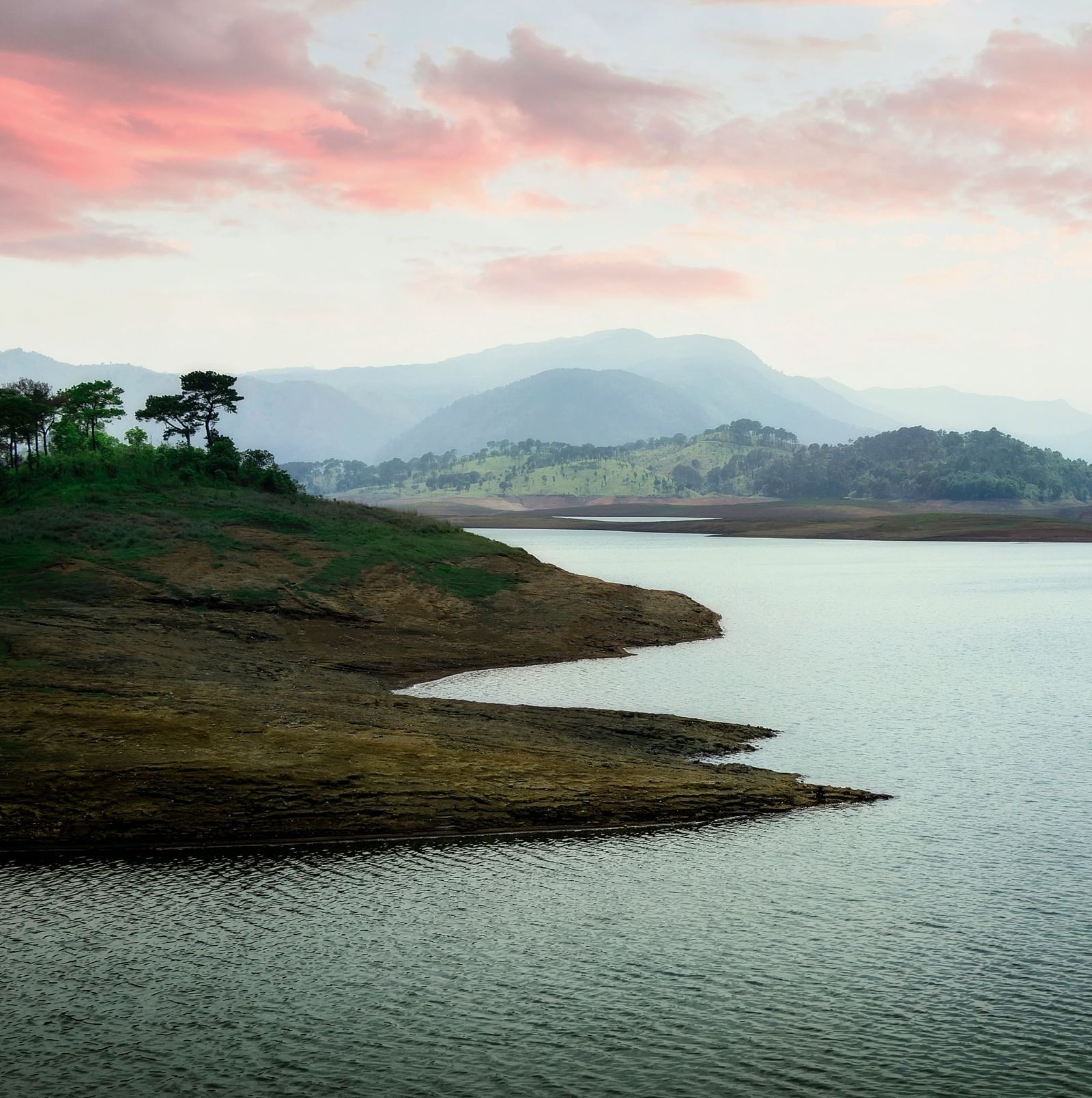 A serene lake in Shillong, observed during a sunset.