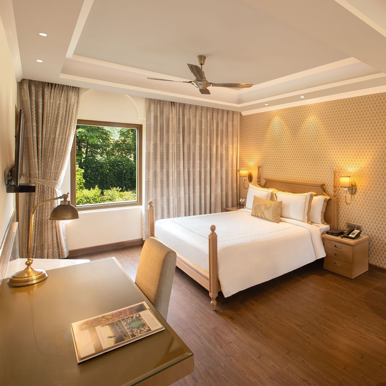 suite in manesar with a comfy king size bed, lavish interiors and wooden flooring