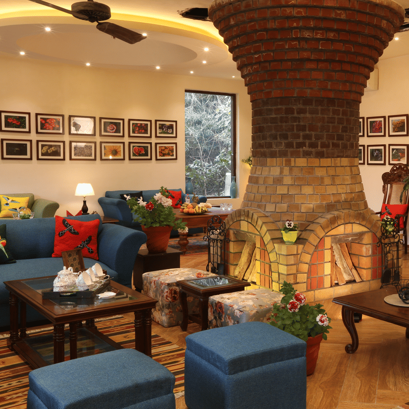  A living room with a fireplace and comfortable seating.