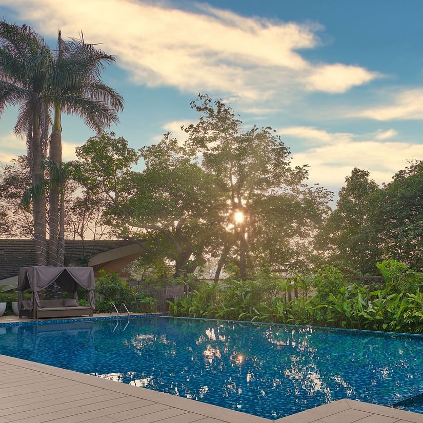 sunset view by the pool, with vibrant colours reflecting on the water at The Dukes Retreat