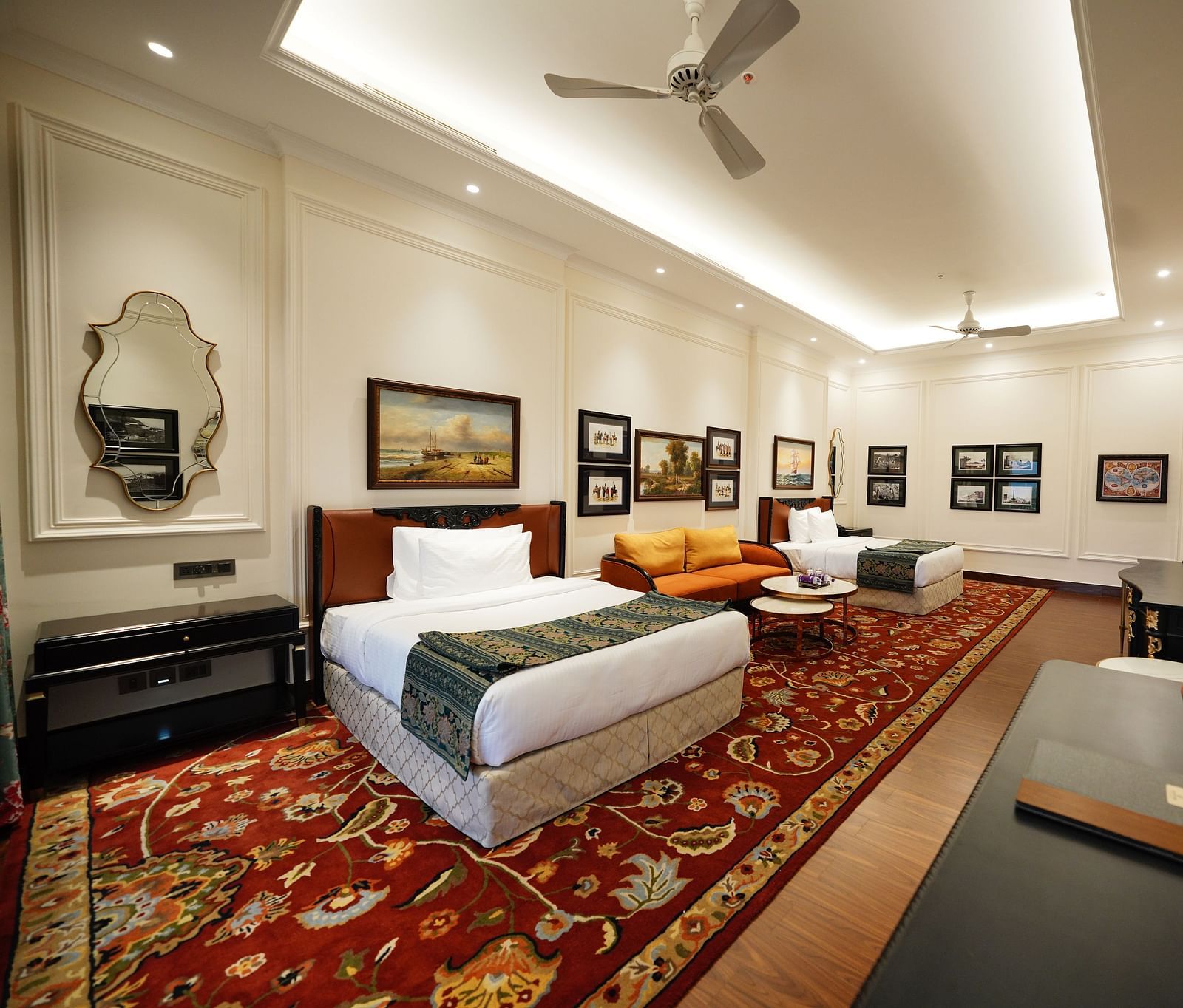 Modern suite with a blend of classic and contemporary decor and dark furnishings.