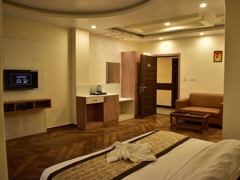 Deluxe Room - a pristine white bed with soft linens and clean pillows designed with soft lights and aesthetic interior2 - Hotel Montana Vyoo