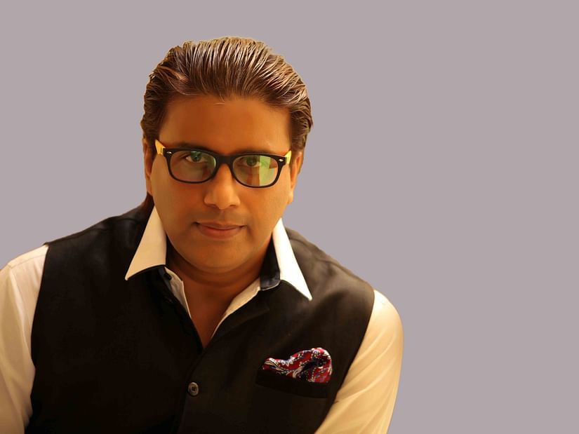 Raja Gopaal Iyer, Chief Executive Officer at UDS Group of Hotels in gray background