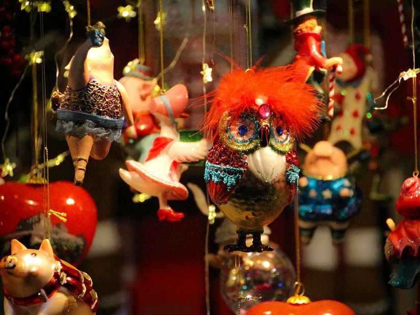 A collection of colourful ornaments suspended from strings, creating a festive and decorative display