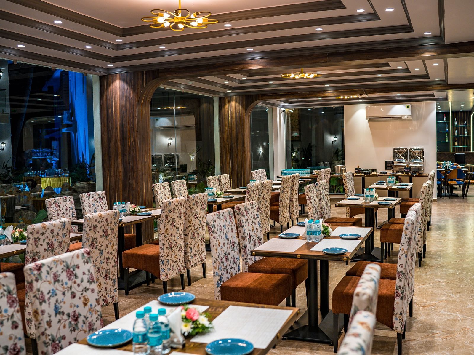 seating arrangements inside the in-house restaurant - The Tanisi Hotels & Resorts, Goa