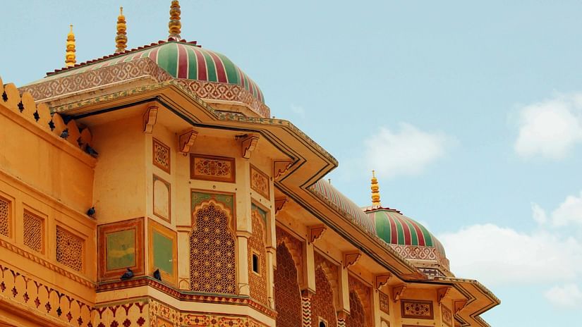 intricate murals on the wall of Rajasthani fort