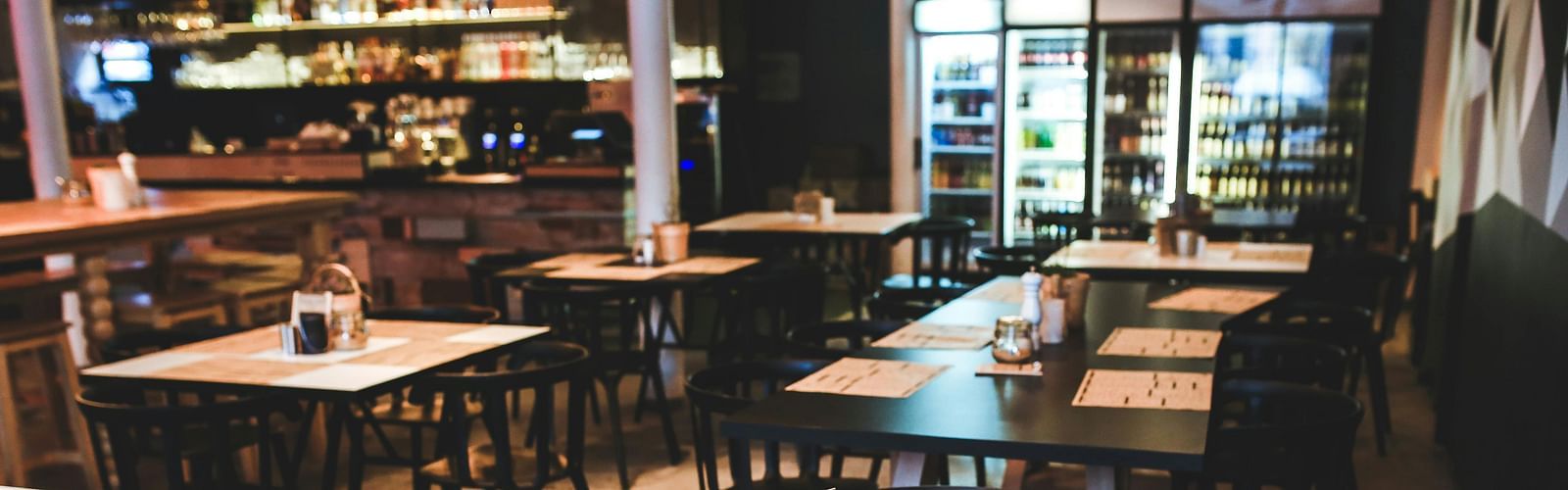An image of a restaurant with seating arrangement with simple decor
