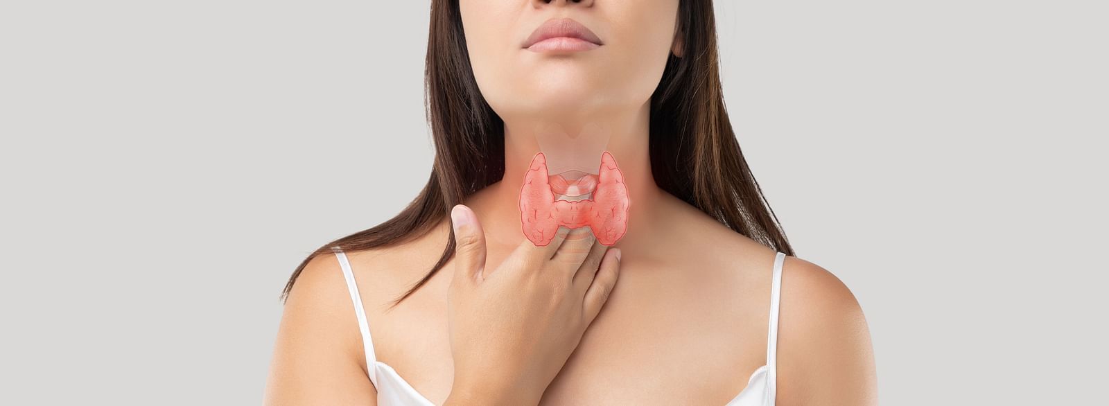 A woman touching her throat indicating discomfort - Shreyas Retreat