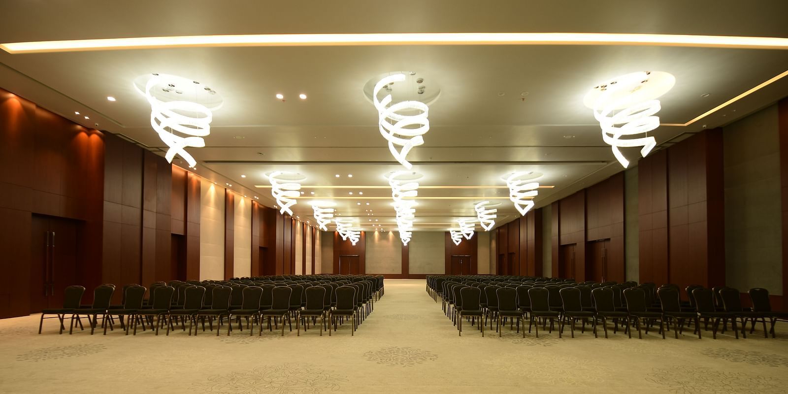 An event space with chairs neatly arranged on both sides